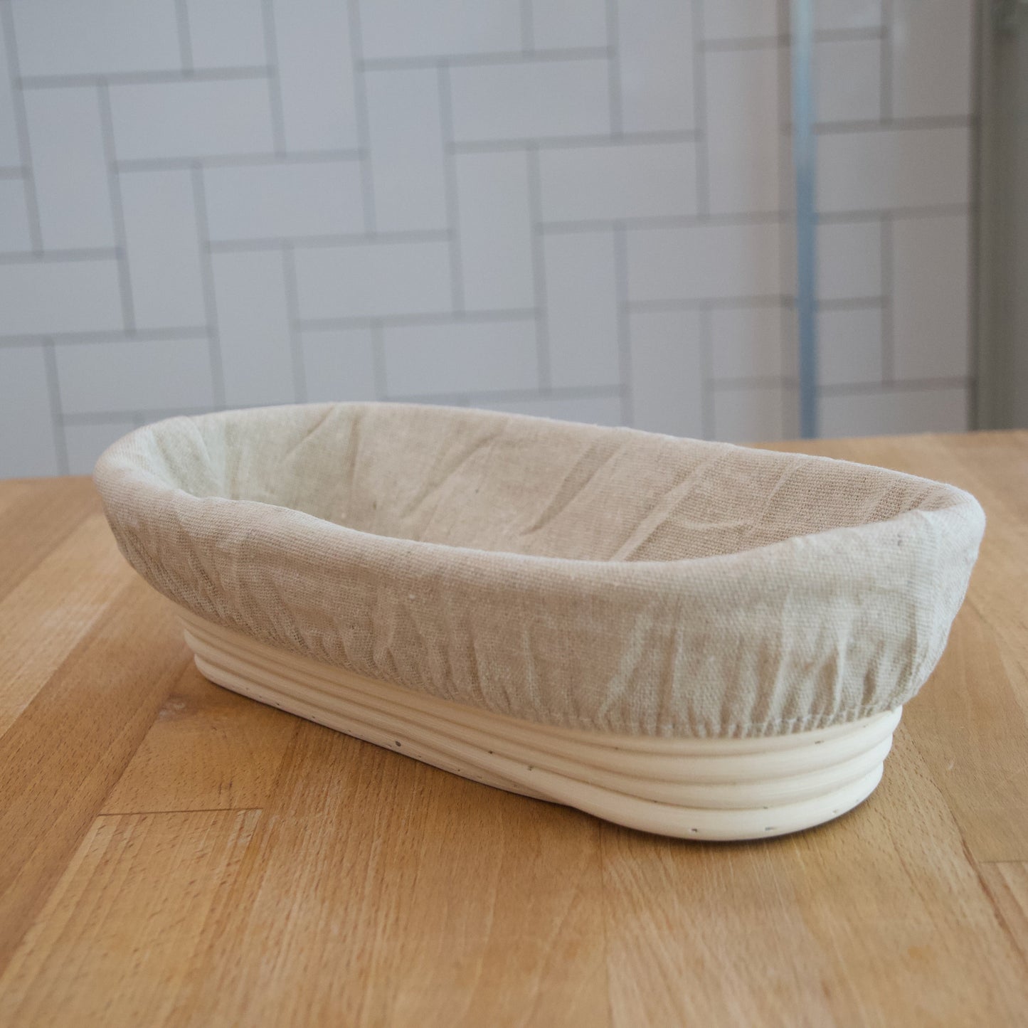 Ovaal rijsmandje met linnen liner